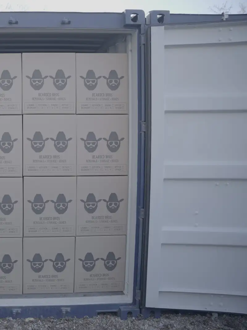 Boxes stacked inside a Bearded Bros storage container