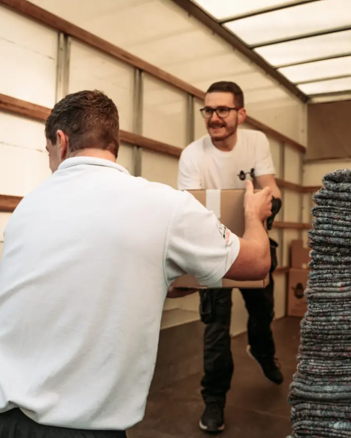 Bearded Bros crew loading boxes into a removals van