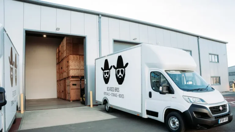 Bearded Bros storage and removals van with wooden crates at Brighton facility
