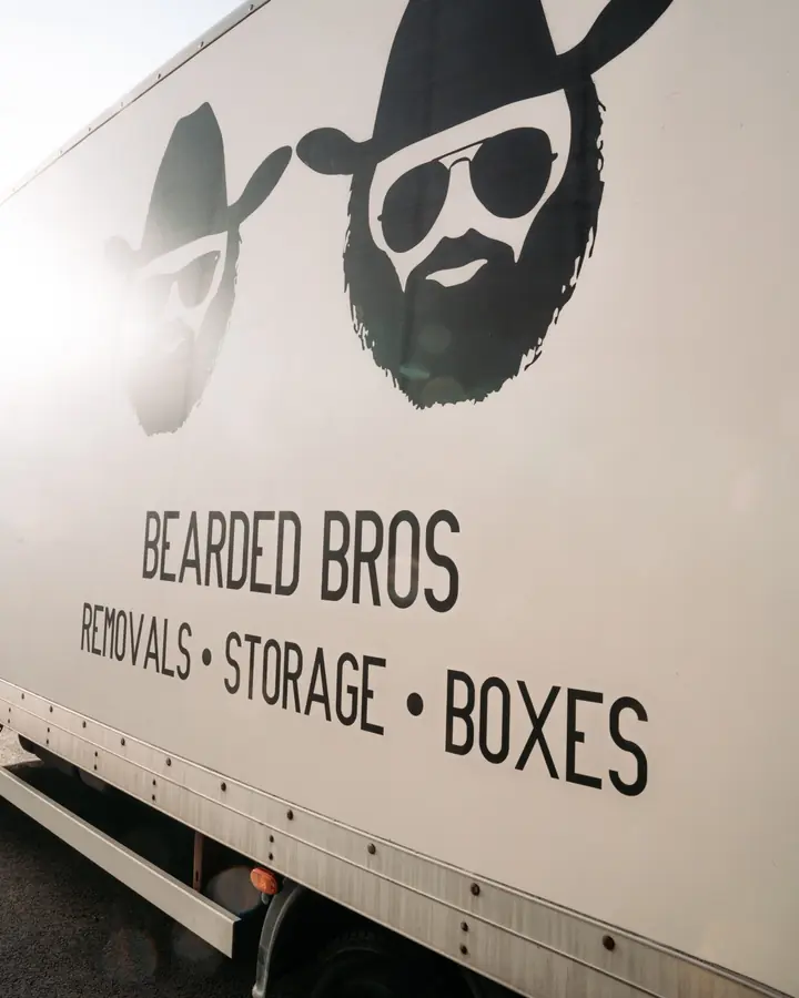 Bearded Bros removals van parked on a residential street