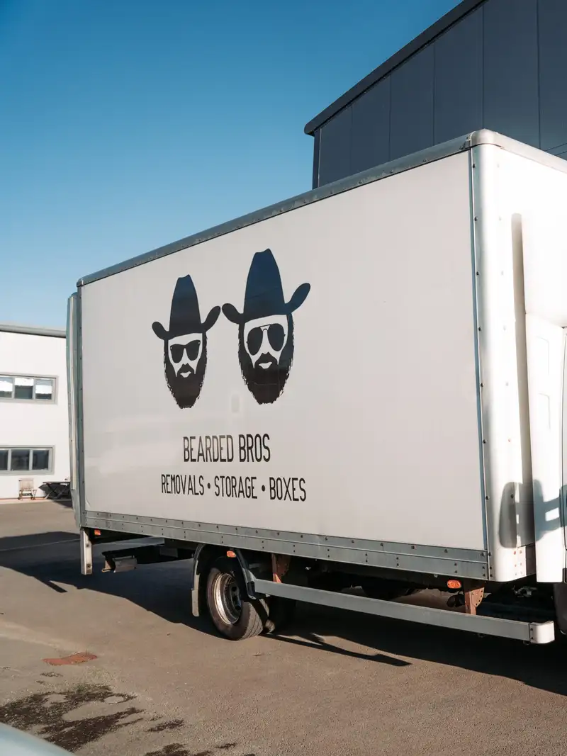 Bearded Bros branded removals van parked outside the depot