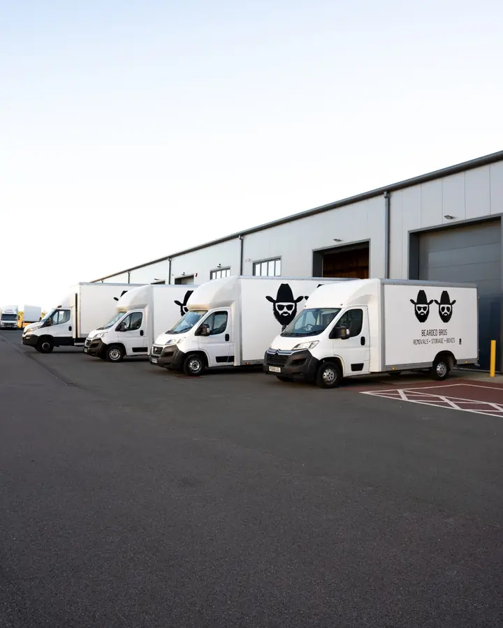 Bearded Bros removals van fleet parked outside the Brighton depot, East Sussex