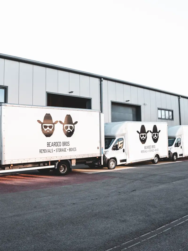 Bearded Bros removals van fleet parked outside the Brighton depot