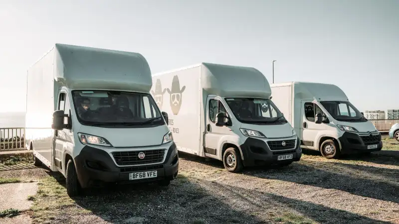 Removals vans parked ready for a moving job, Bearded Bros